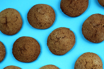 Texture of oatmeal cookies close-up tasty brown color on blue background