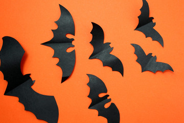 Halloween holiday concept with paper black bats.