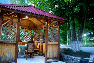 Beautiful wooden gazebo in the courtyard