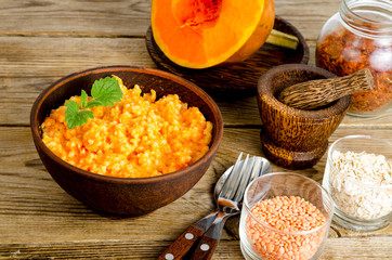 Vegetarian food, porridge with pumpkin and lentils.