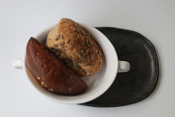 Bread on a Black Plate , White Background