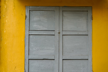 Obraz na płótnie Canvas windows wood green Vintage and yellow wall texture
