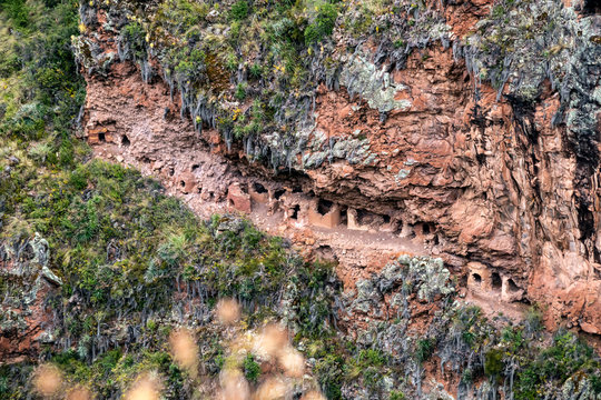 Hillside tombs at the biggest cemetery from Incan time, Pisac Inca Ruins in the Sacred Valley of the Incas, Cusco, Peru