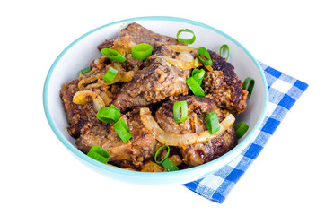 Fried liver with onions in bowl on white background.