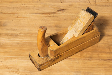 Old tools. Wooden planer. Joiner's tool.