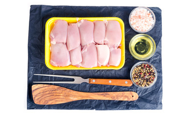 Raw chicken meat in yellow tray. Photo