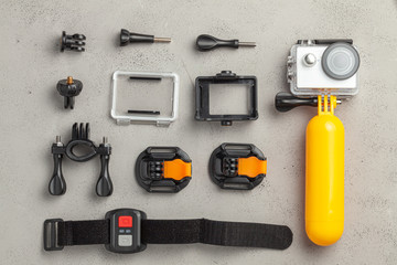 Action camera in a waterproof box and a buoy for diving and various accessories, clamps and holders, remote control.