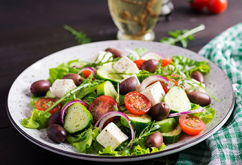 Greek salad with fresh vegetables, feta cheese and kalamata olives. Healthy food.