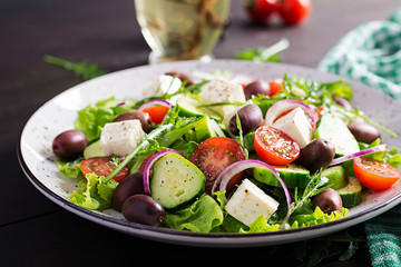 Greek salad with fresh vegetables, feta cheese and kalamata olives. Healthy food.