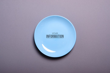 Blue empty plate on gray background, space for text