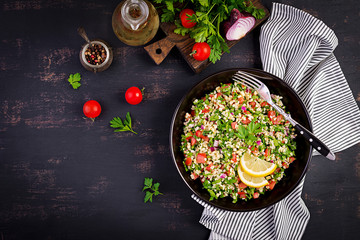 Tabbouleh salad. Traditional middle eastern or arab dish. Levantine vegetarian salad with parsley,...