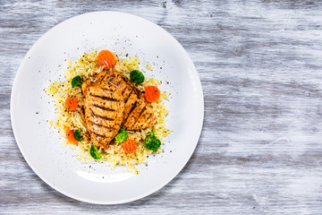 Grilled chicken fillets, rice and vegetables