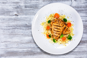 Grilled chicken fillets, rice and vegetables