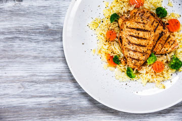 Grilled chicken fillets, rice and vegetables