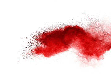 Red powder explosion on white background. Colored cloud. Colorful dust explode. Paint Holi.