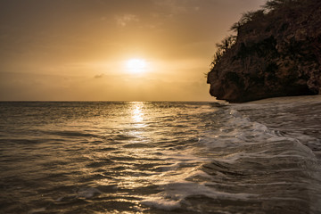 Fototapeta na wymiar A fantastic sunset at the beach with a bonfire and BBQ on the island of Curacaio