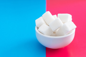 pressed sugar cubes in a ceramic Cup.