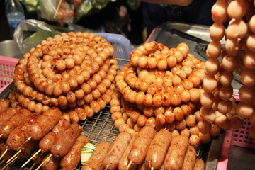 Thai street food on the streets in Bangkok in the evening people come to buy food. delicious food in Asia. Night market.