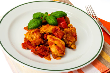 Chicken breast fillet braised with vegetables, paprika.