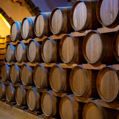 Vintage wine cellar with old oak barrels, production of fortified dry or sweet marsala wine in Marsala, Sicily, Italy