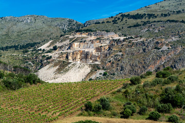 Fototapeta na wymiar Extraction of Perlato and Perlatino of Sicily light biege marble, marble quarries near Trapani, Sicily, Italy