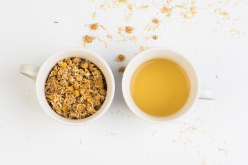 cup of  chamomile and dried flowers 