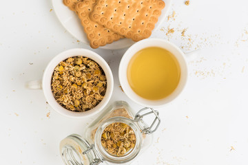 cup of  chamomile and dried flowers 