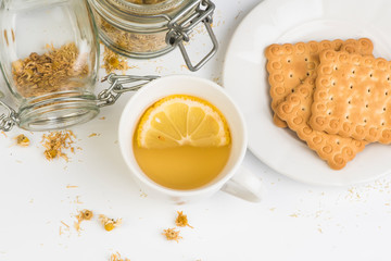 cup of  chamomile and dried flowers 
