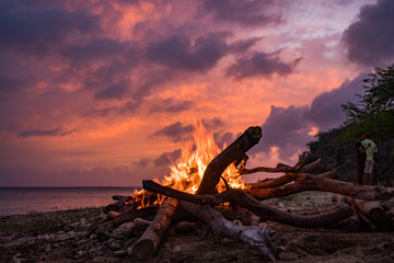 A fantastic sunset at the beach with a bonfire and BBQ on the island of Curacaio