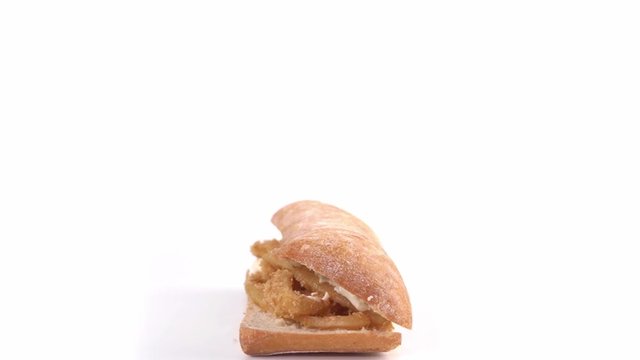 Bocadillo de Calamares Rings of calamari whit white sauce ginger mayonnaise - calamares fritos tipical spanish street food - squid whit white screen rotating in movement, fried recipe