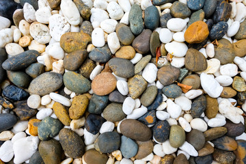 Sea pebbles. Small stones gravel texture background.Pile of pebbles, thailand.Color stone in background. 