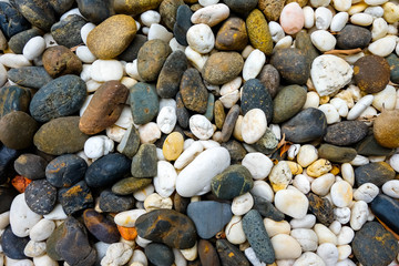 Sea pebbles. Small stones gravel texture background.Pile of pebbles, thailand.Color stone in background. 