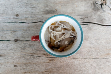Beautiful ice coffee on wood table
