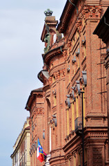 Fototapeta na wymiar Turin, Piedmont/Italy -Turin the curved brick façade of Palazzo Carignano, home to the first parliament of unified kingdom of Italy.