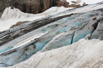 Fototapeta na wymiar Mountain glaciers and large blocks of snow with ice in the eternal glaciers in Alibek, Dombay, Karachay-Cherkess Rep. Russia