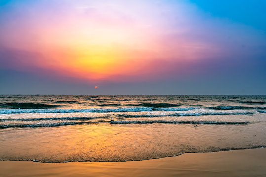 colorful sunset at the beach in India.