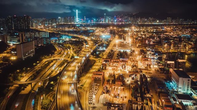 4K hyperlapse time-lapse of Hong Kong port industrial district, highway traffic, and the city Symphony of light show on buildings. Asia developing country, logistic industry, or Asian tourism concept