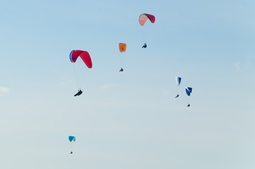 Paraglider is flying in the valley. Paragliding from the mountain with perfect view