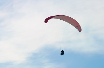 Paragliding in the sky.paraglider fly over the mountain valley. Competitions with paragliding, Russia, Siberia