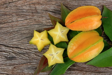 Carambola or star apple ( starfruit ) on old wooden background,Close up healthy carambola or star...