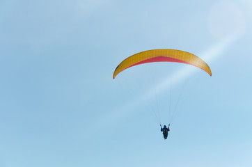 Paragliding in the sky.paraglider fly over the mountain valley. Competitions with paragliding, Russia, Siberia