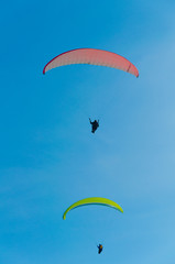 Paragliding in the sky.paraglider fly over the mountain valley. Competitions with paragliding, Russia, Siberia