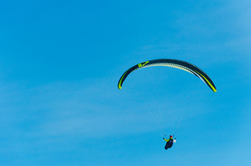 Paragliding in the sky.paraglider fly over the mountain valley. Competitions with paragliding, Russia, Siberia