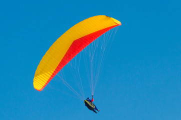 Paragliding in the sky.paraglider fly over the mountain valley. Competitions with paragliding, Russia, Siberia