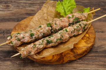 Raw minced pork skewer kebab for grill