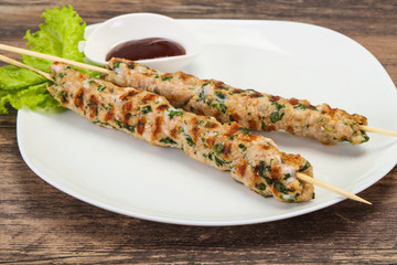 Minced pork skewer kebab with sauce