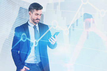 Businessman looking at phone in city, diagrams