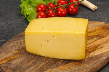 Hard yellow tasty cheese brick