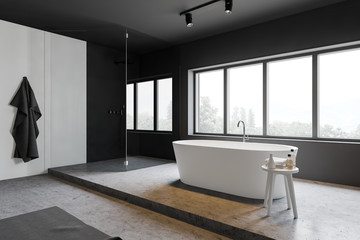 Gray and white bathroom corner, tub and shower