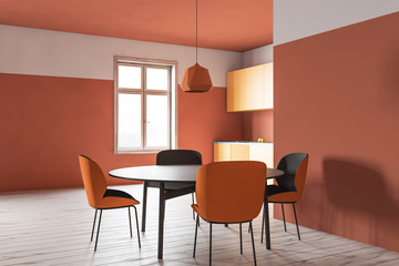 Orange kitchen corner with round table